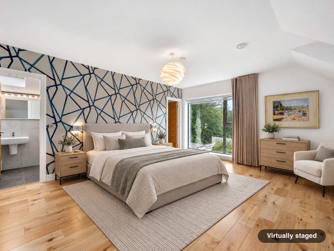 The same bedroom virtually staged with a double bed, bedside tables and a chest of drawers, its feature wall, ensuite door and window unchanged